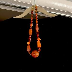 Women’s single strand wood and bead necklace